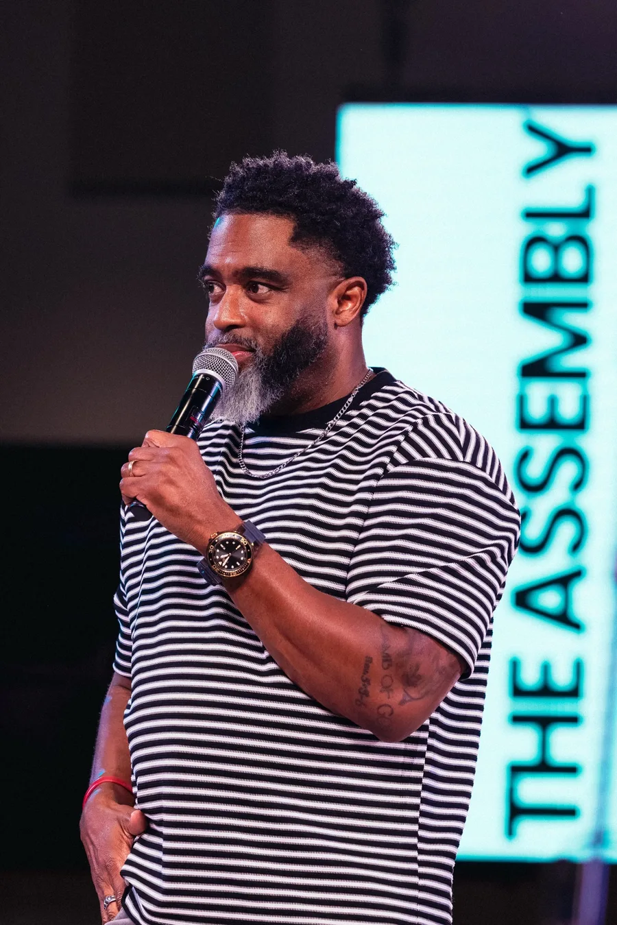 Dr. Wayland Henderson teaching with a microphone